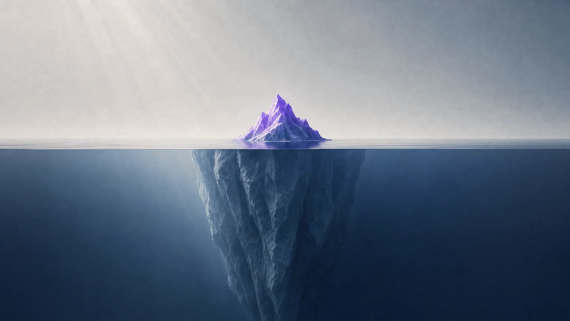 An iceberg with a small purple tip above the waterline and a massive blue-gray mass hidden underwater