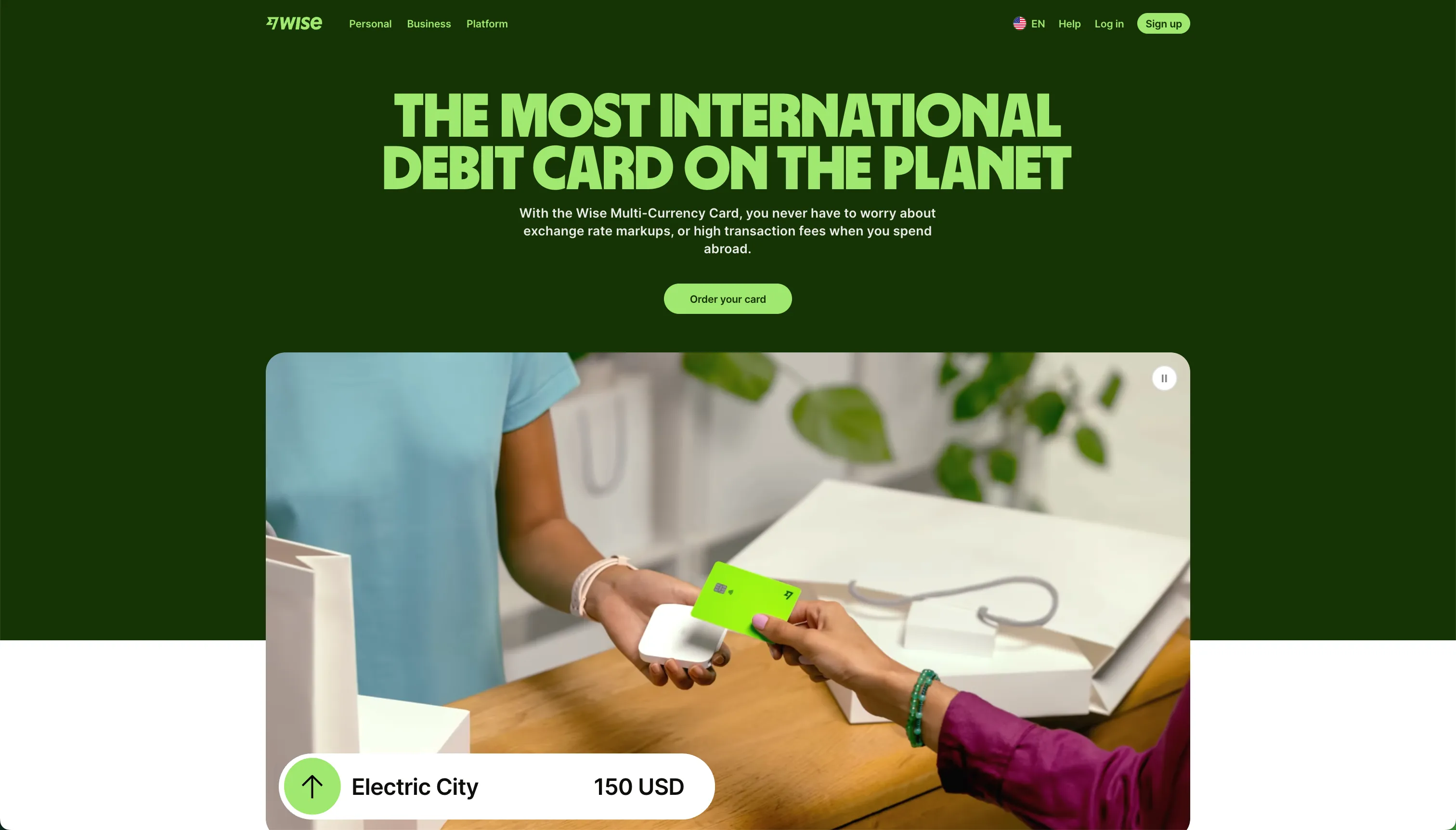 The Wise card page showing a multi-currency debit card funded from a fiat balance, spending at the mid-market exchange rate with low conversion fees and free monthly ATM withdrawals across 160-plus countries