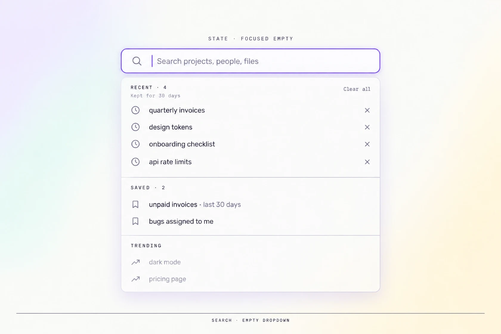 A focused empty search field with an open dropdown of recent and saved queries