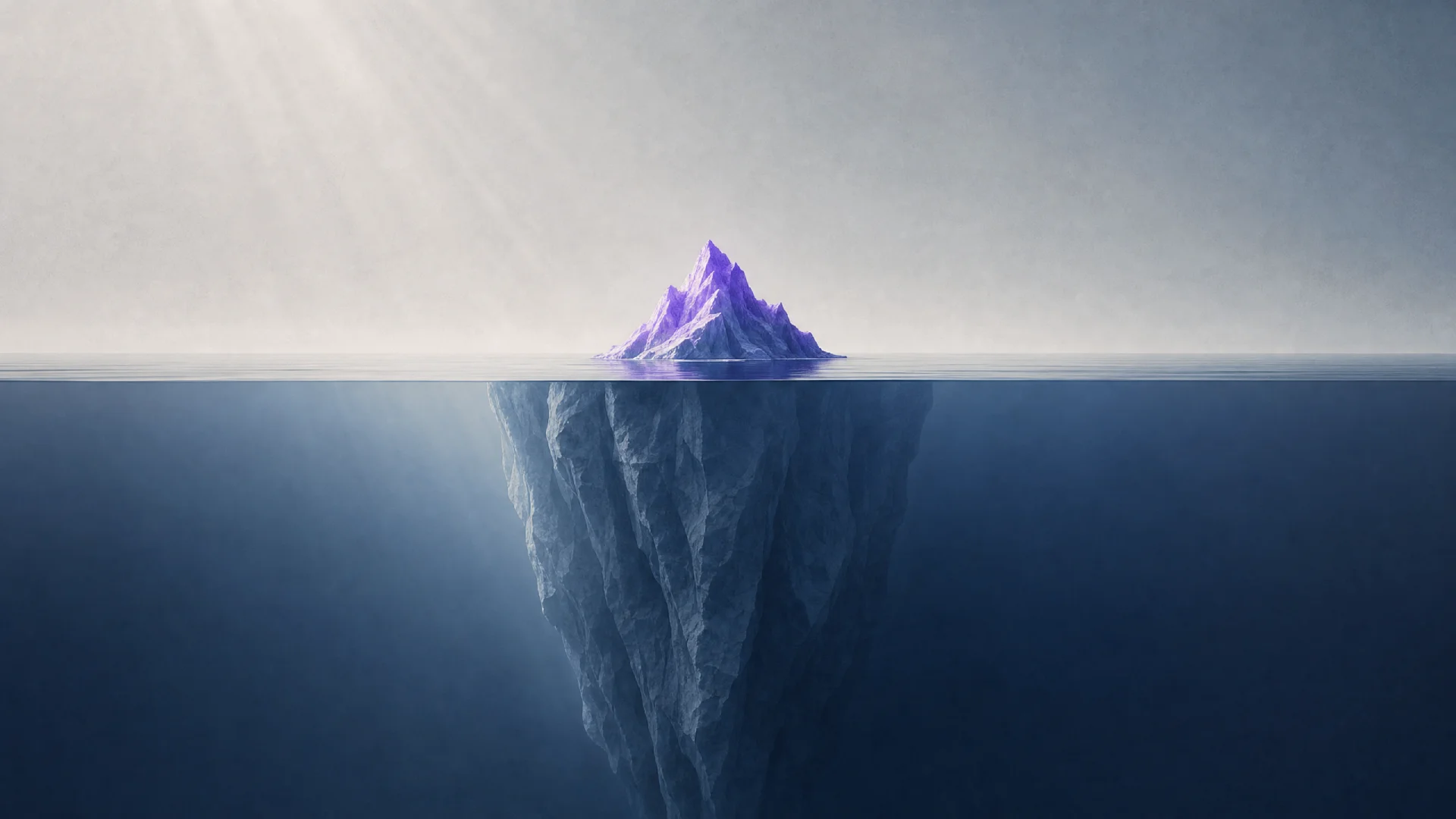 An iceberg with a small purple tip above the waterline and a massive blue-gray mass hidden underwater